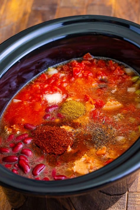 seasonings added to chili mixture in crock pot.