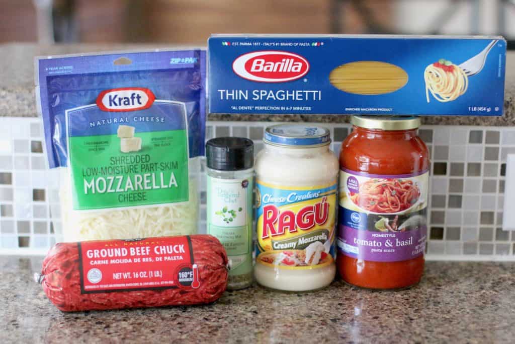baked spaghetti ingredients: spaghetti noodles, ground beef, spaghetti sauce, alfredo sauce (cheese sauce) Italian seasoning, shredded mozzarella