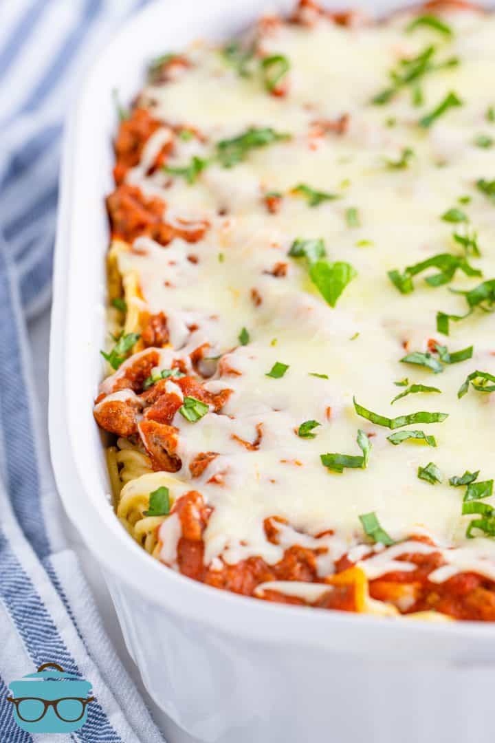 fully cooked baked spaghetti shown in a white baking dish