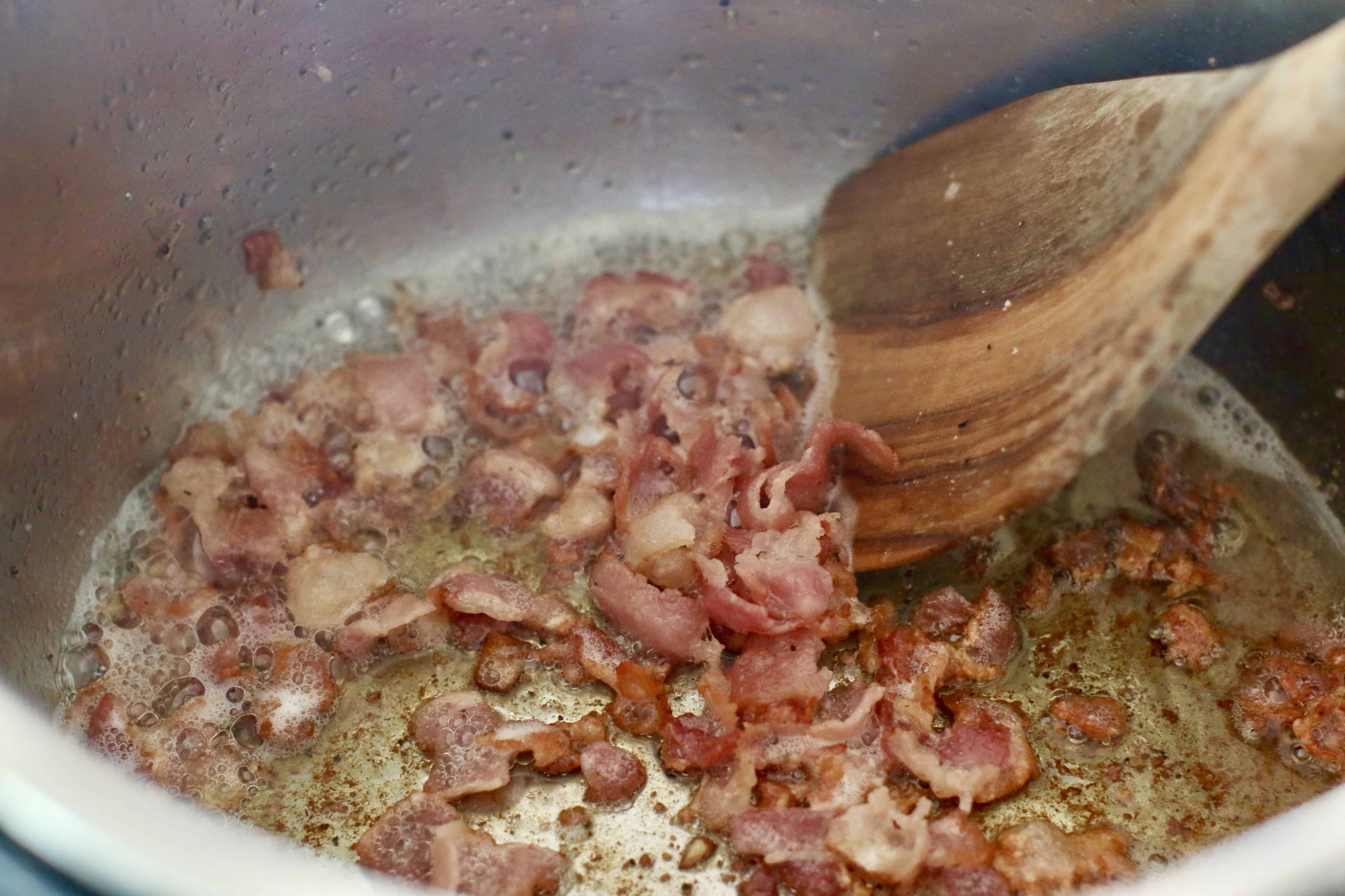 cooking chopped bacon in an Instant Pot.
