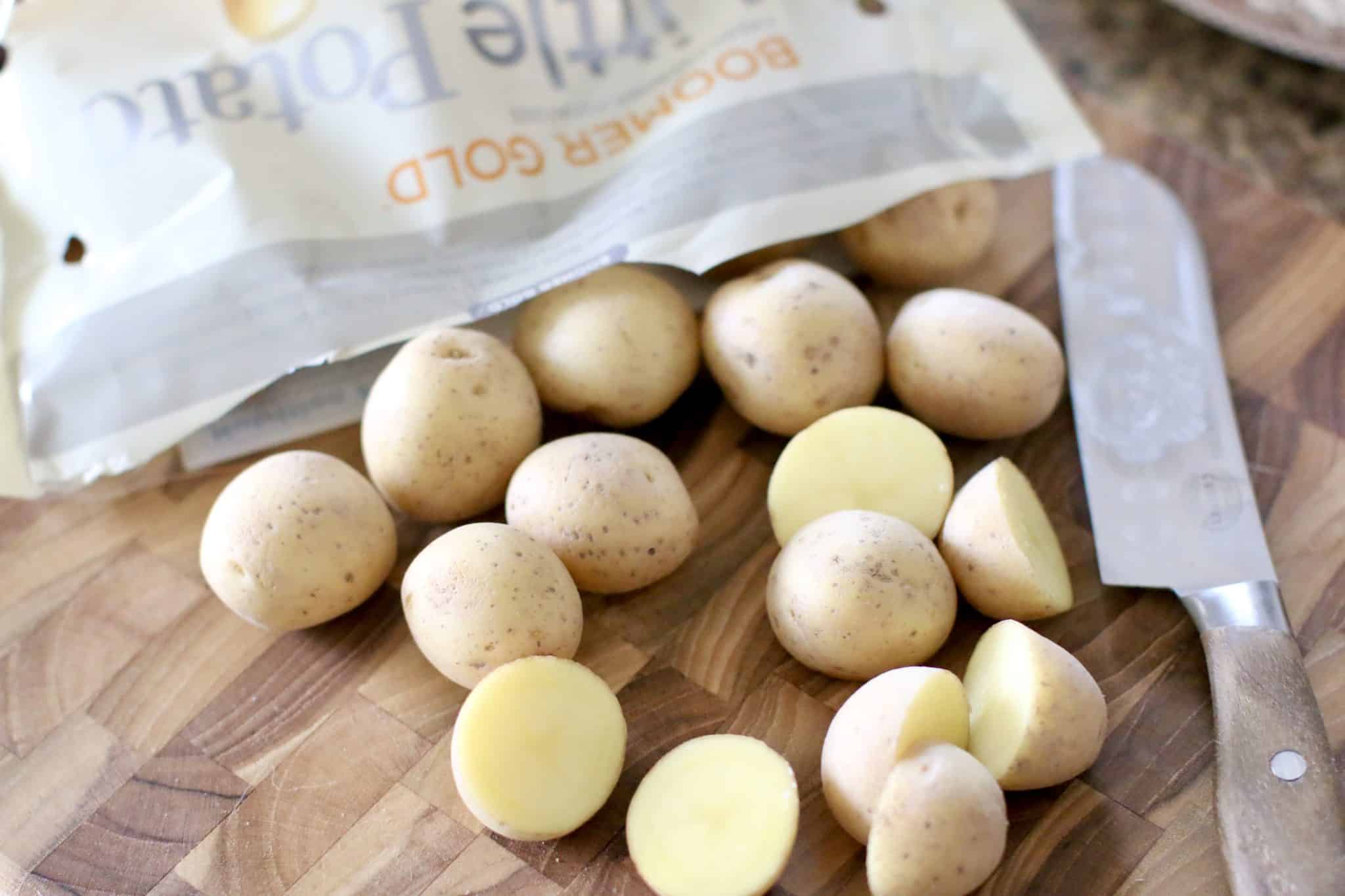 sliced Boomer Gold Little Potatoes on a cutting board