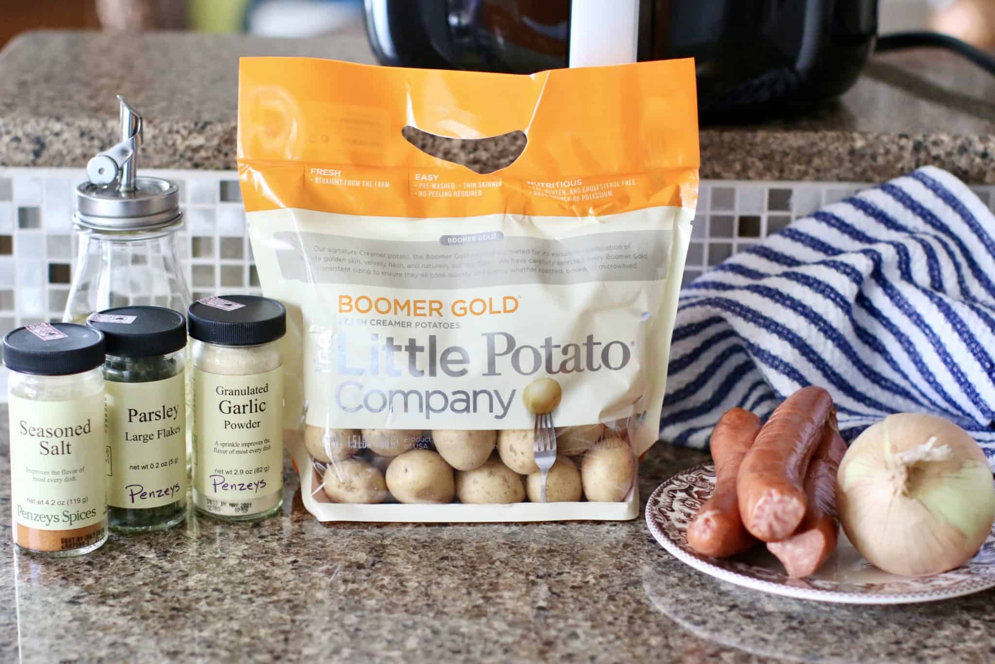 Boomer Gold Little Potatoes, small onion oil, seasoned salt, garlic powder, freshly ground black pepper, smoked sausage, dried parsley
