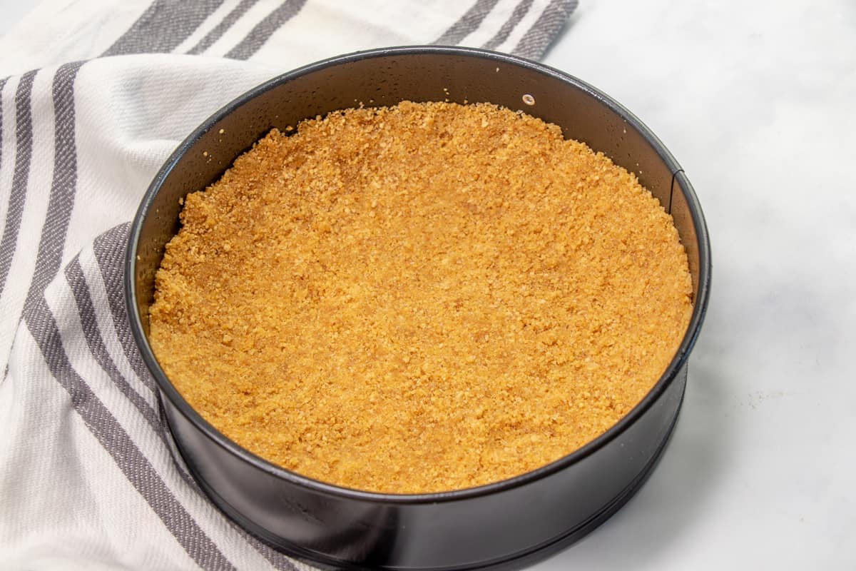 graham cracker crust pressed into the bottom of a 7-inch springform pan.