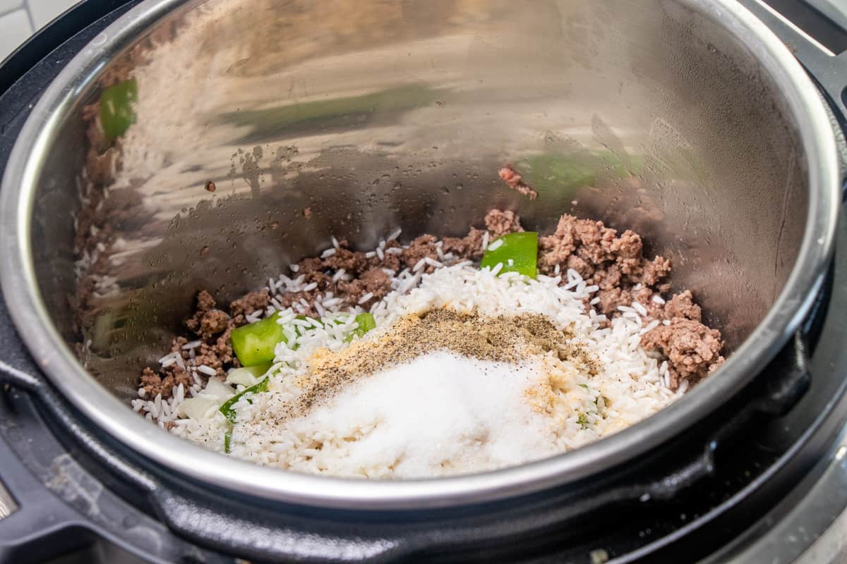 cooked ground beef with rice, green pepper, onion and seasonings added