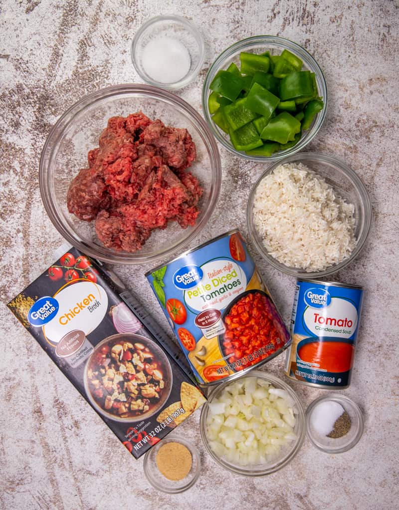 lean ground beef, small yellow onion, green bell peppers, uncooked long-grain rice, sugar, garlic powder, salt and pepper, can diced tomatoes with basil, garlic and oregano, can tomato soup, chicken broth, shredded cheddar cheese