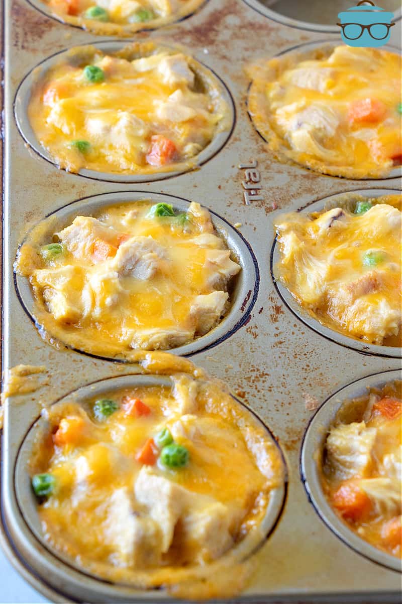fully baked mini chicken pot pies in a muffin pan.