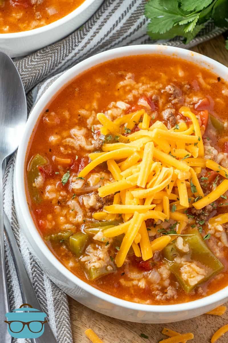 Stuffed Pepper Soup in a bowl topped with shredded cheddar cheese