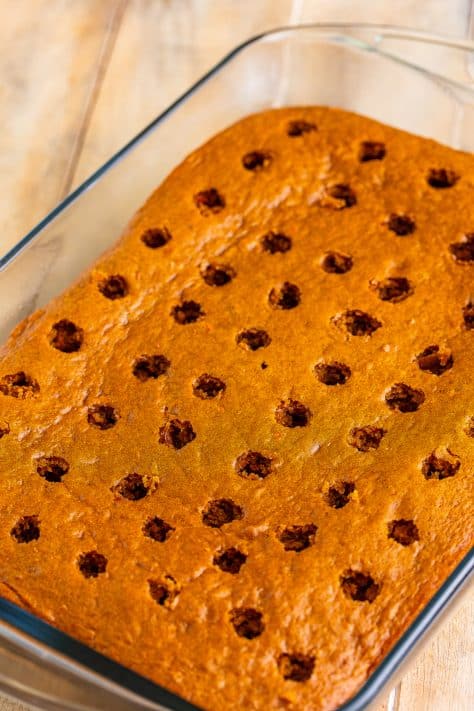 A baked Carrot Cake with holes in it.