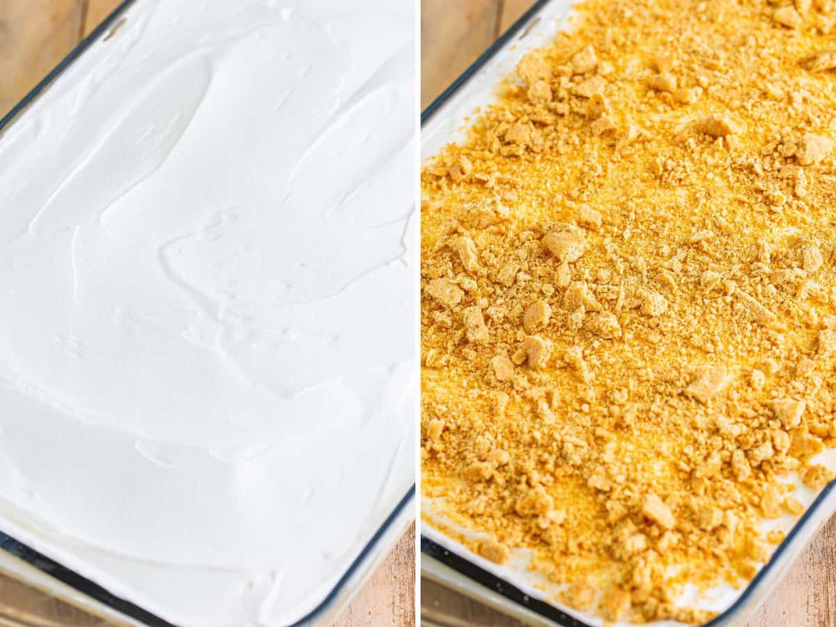 Whipped topping over a layered pudding and cake cake in a glass baking dish. Graham crackers sprinkled on top of a Carrot Poke Cake.