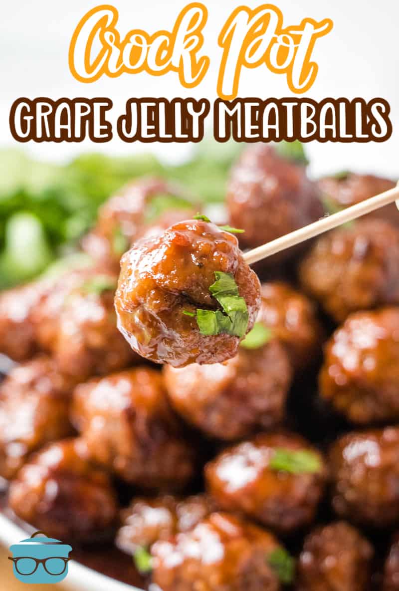 A toothpick holding up a grape jelly meatball.