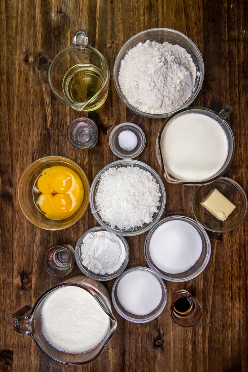 all purpose flour, salt, oil, water, sugar, cornstarch, half and half, egg yolks, butter, sweetened flaked coconut, coconut extract, heavy whipping cream, powdered sugar. 