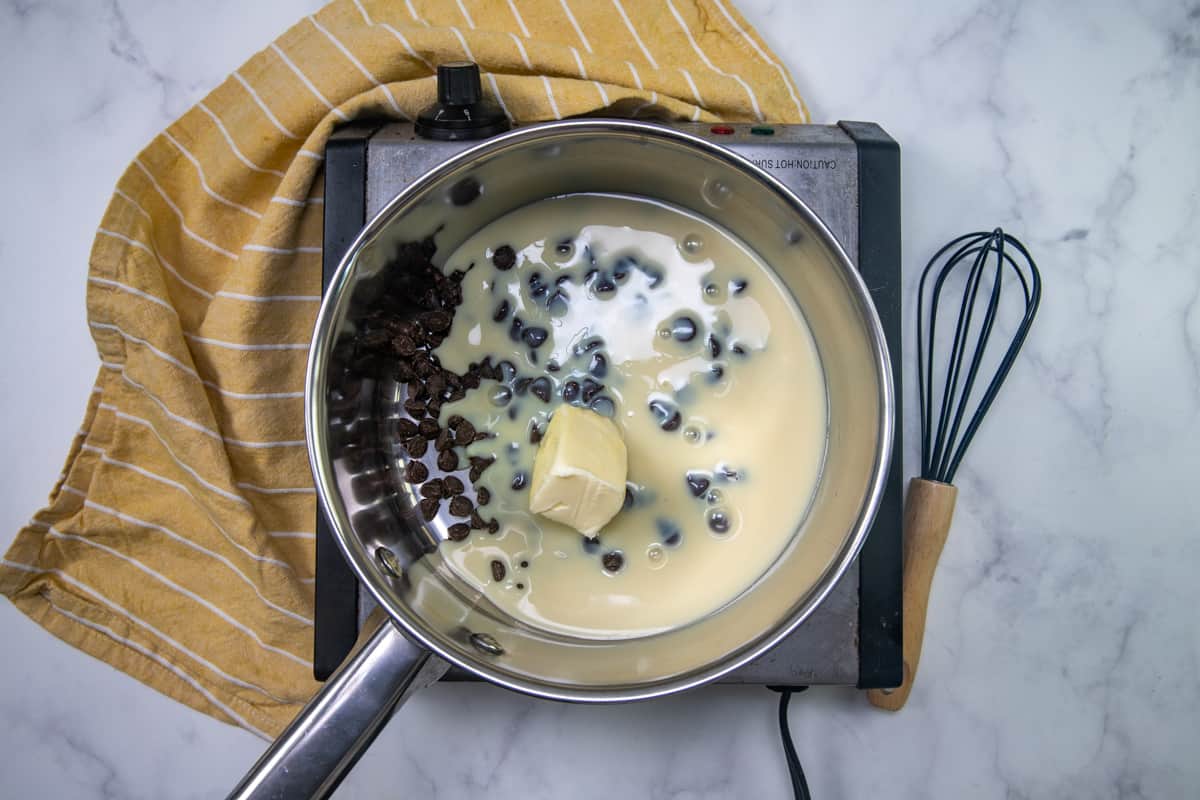 sweetened condensed milk, butter and chocolate chips in a saucepan.