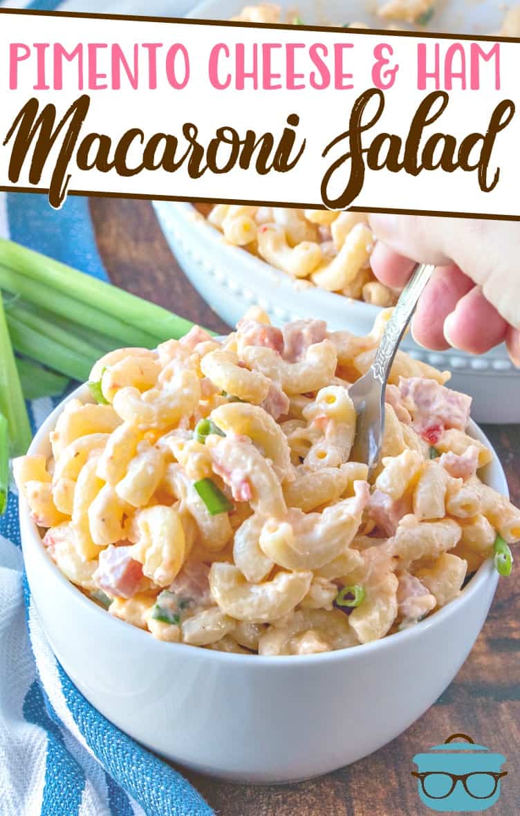 Pimento Cheese and Ham Macaroni Salad recipe from The Country Cook, pictured in two serving bowls with a fork going into the macaroni salad.