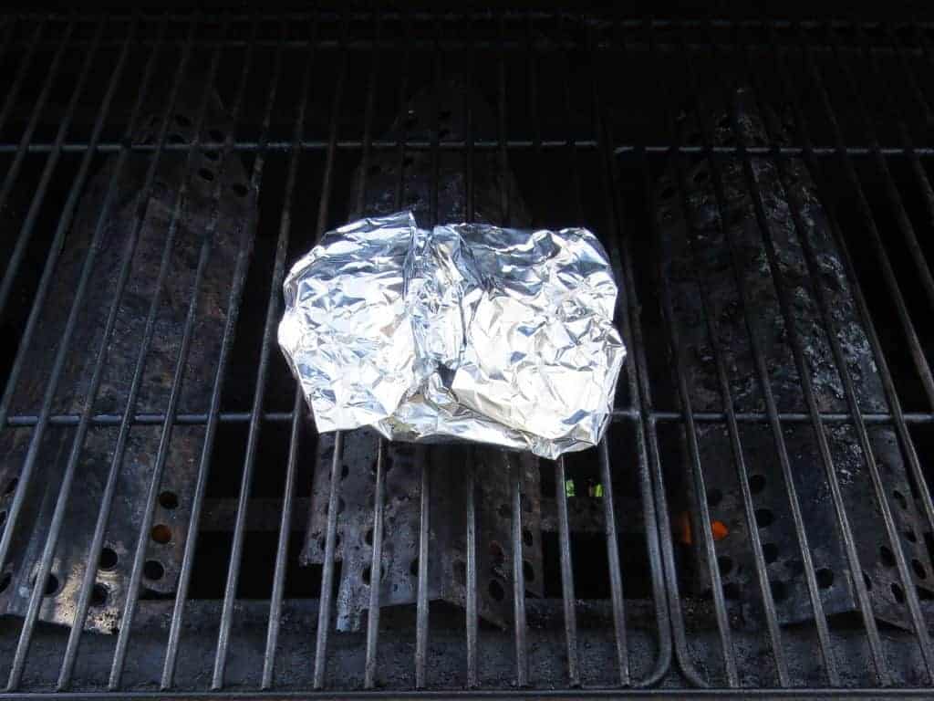 Apple Pie Packet cooking on a grill.