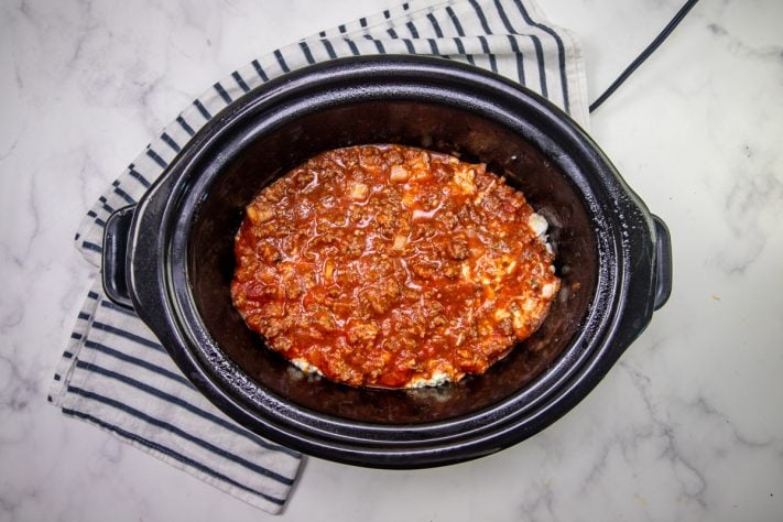 another layer of meat sauce added into crock pot.