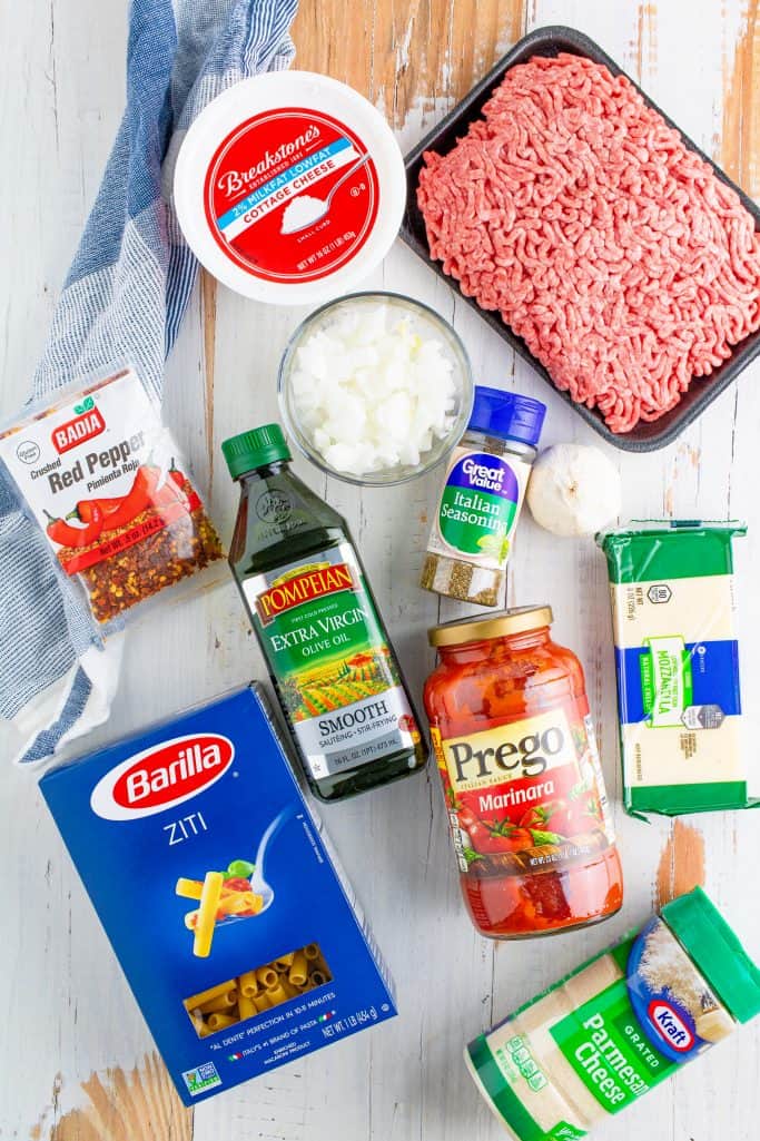 ingredients for instant pot baked ziti: ground beef, olive oil, onions, garlic, Italian seasoning, marinara spaghetti sauce, ziti noodles, water, small curd cottage cheese, mozzarella cheese