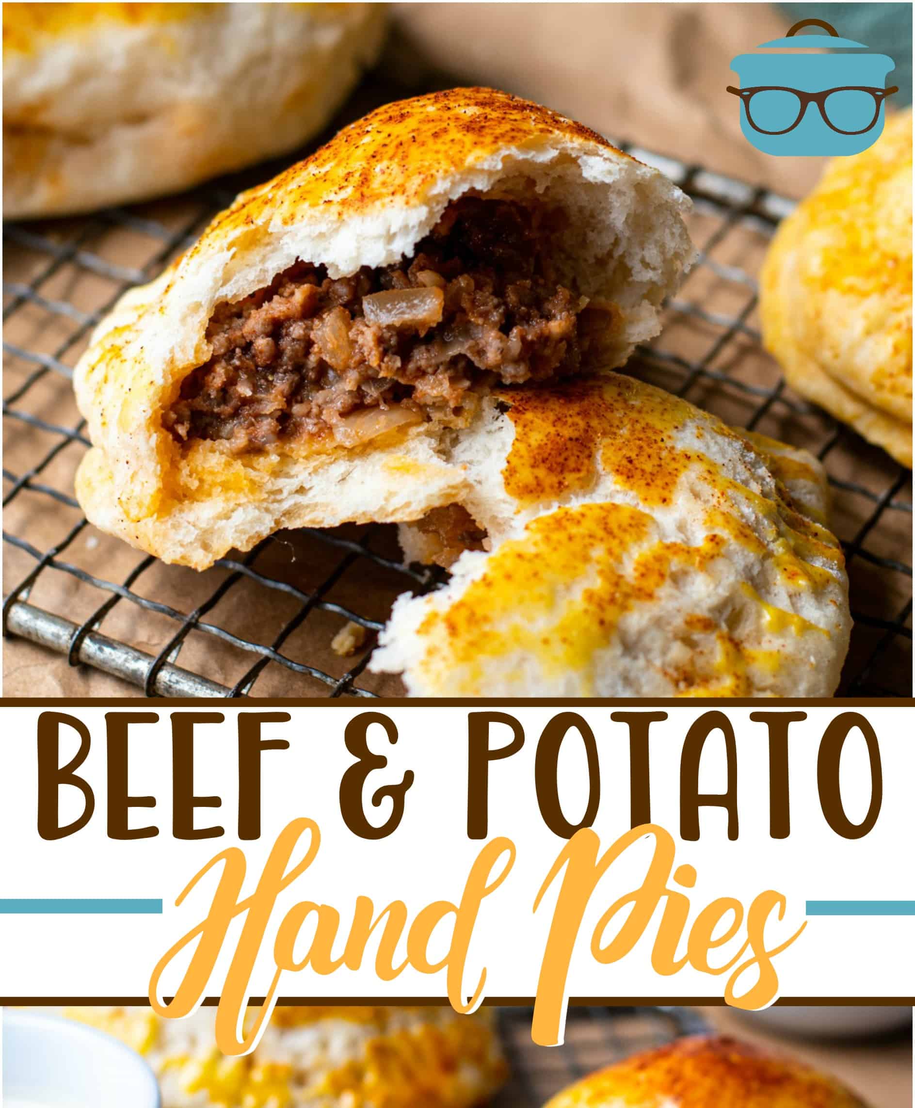 Beef and Potato Hand Pies recipe from The Country Cook, one hand pie split open to show cooked ground beef center.