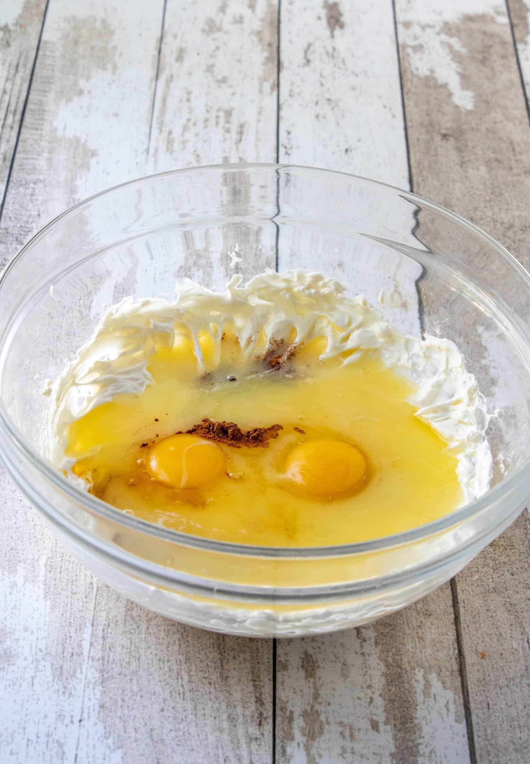 cream cheese, egg, melted butter, ground cinnamon and vanilla extract mixed together in a separate clear bowl.