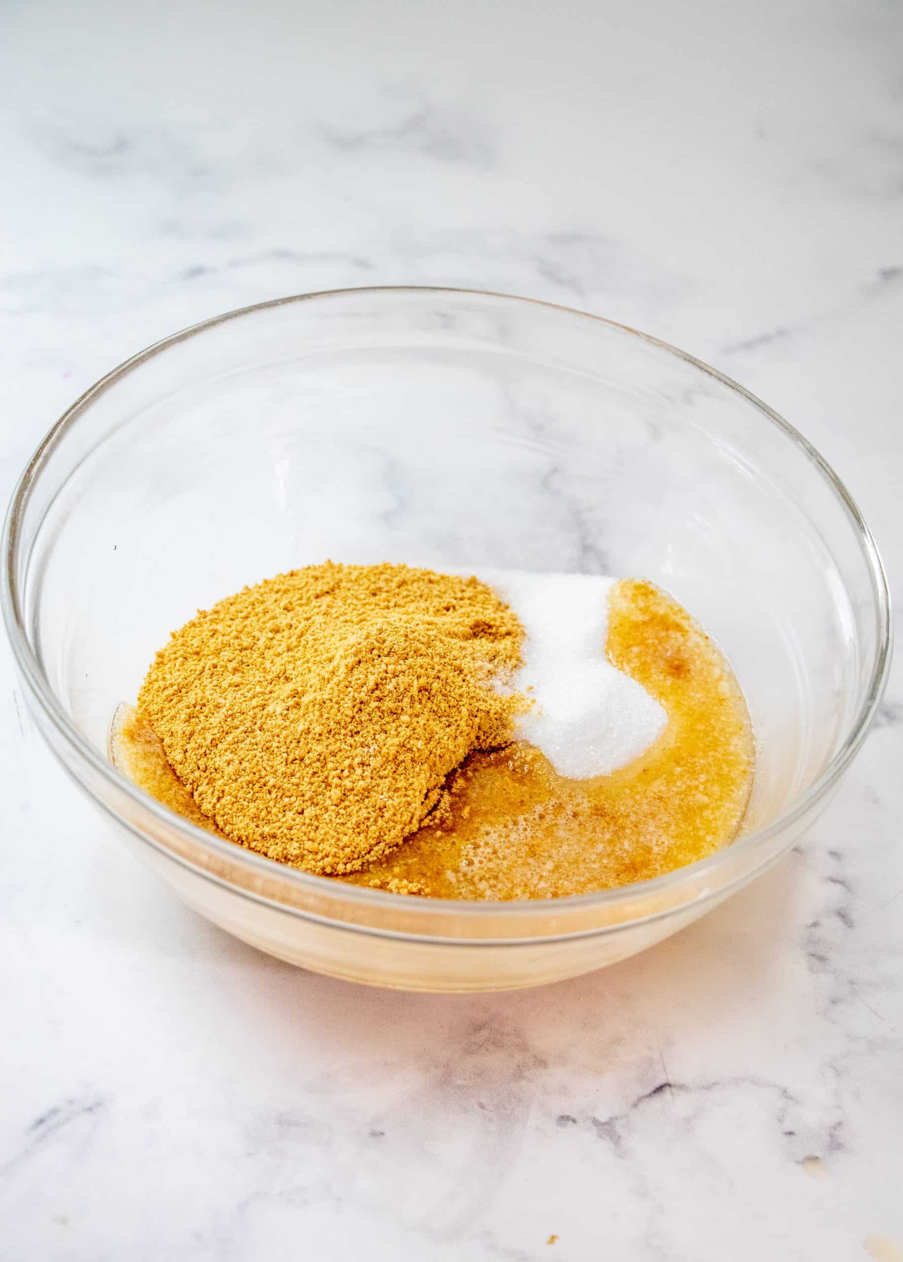 graham cracker crumbs, sugar and melted butter In a bowl.