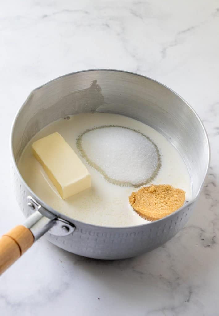 heavy cream, light brown sugar, white sugar and butter in a sauce pot