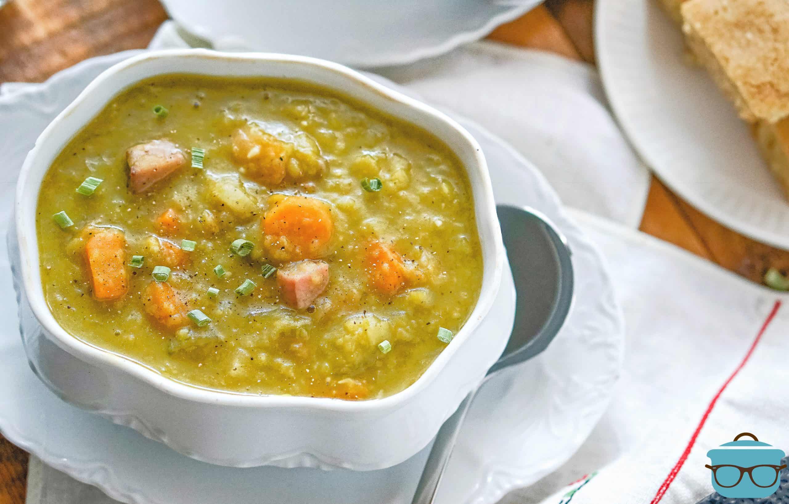 Split Pea Soup in a decorative white soup bowl with a soup spoon on the side.