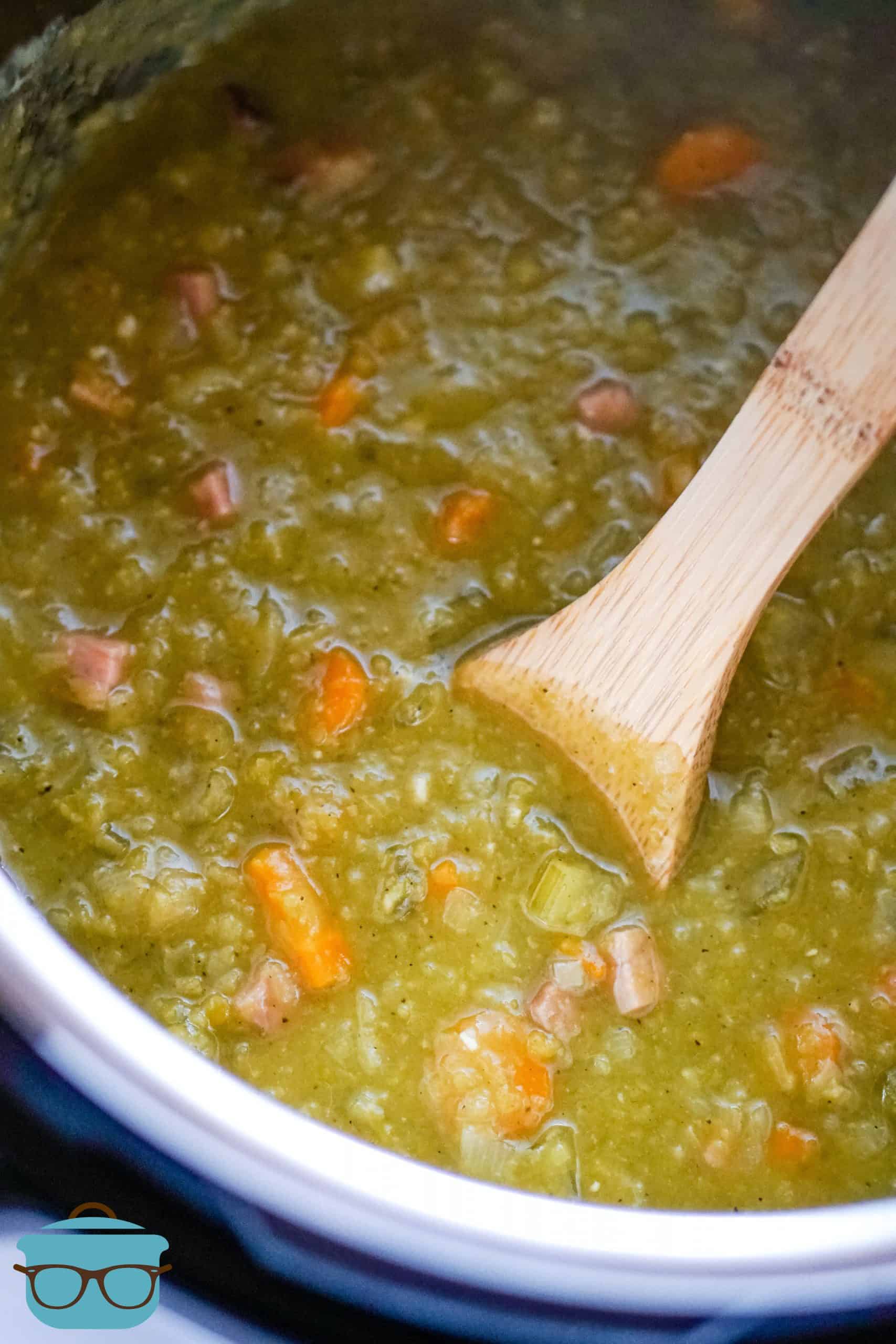 Split Pea Soup, shown in Instant Pot with a wooden spoon.