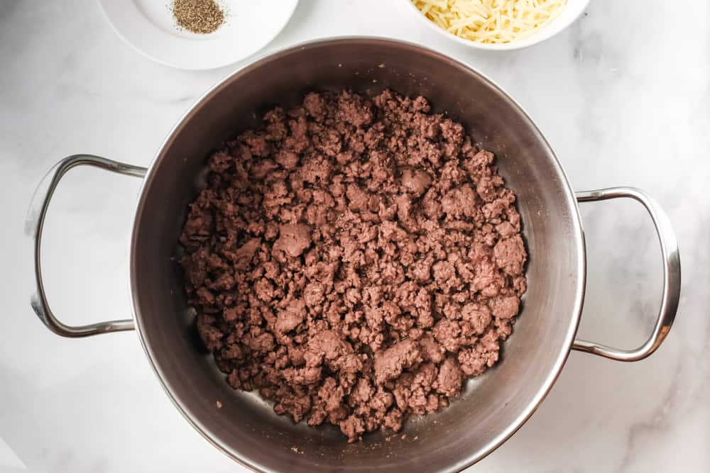 cooking ground beef in a large pan.