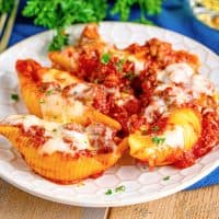 serving of stuffed shells on a white plate.