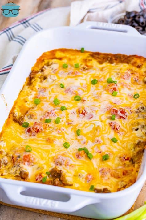 fully baked Mexican Lasagna in a white baking dish.