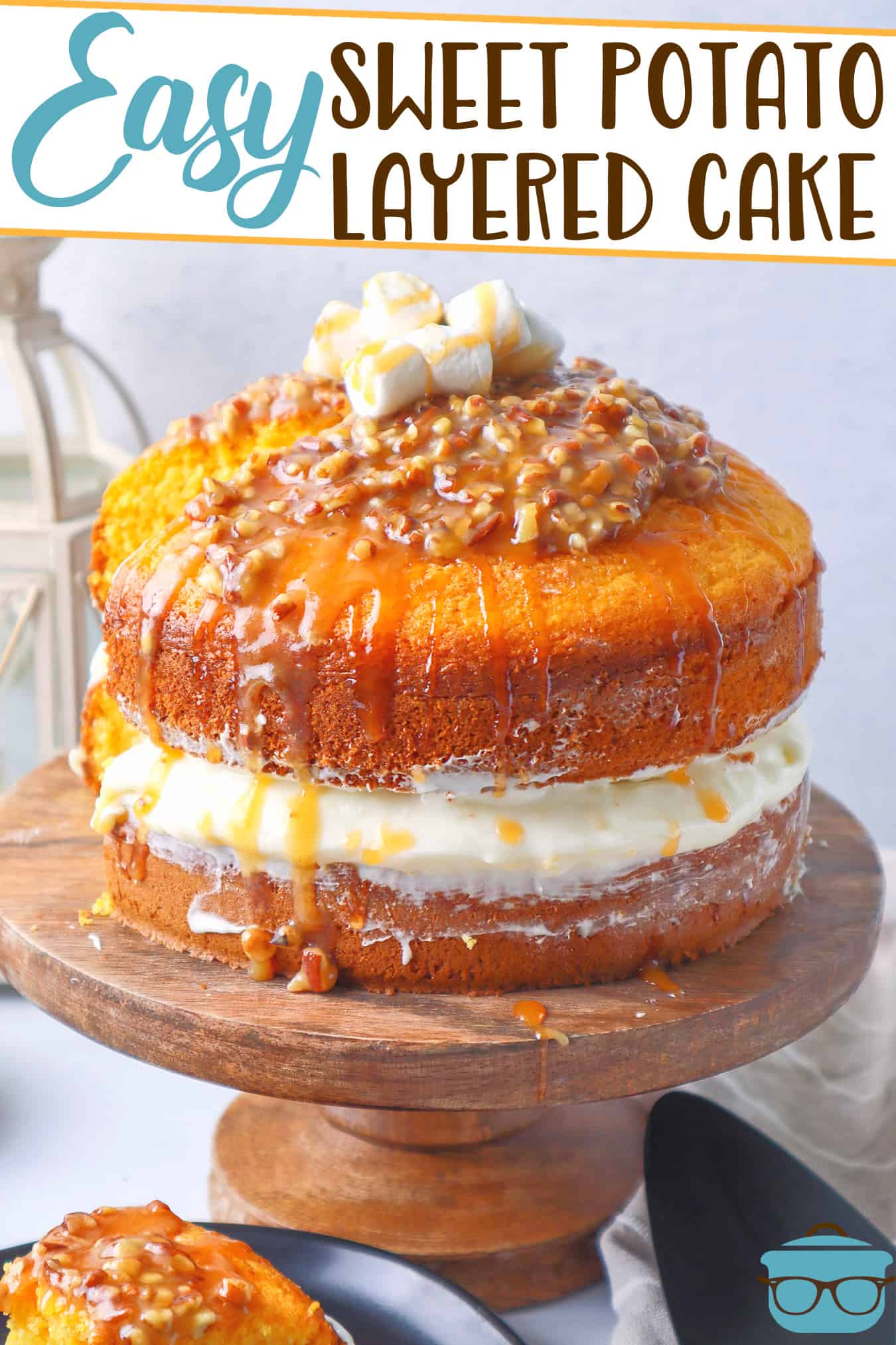 Easy Sweet Potato Layered Cake recipe from The Country Cook, cake shown on a wooden pedestal with a slice of cake removed and on a plate in the front of the cake.