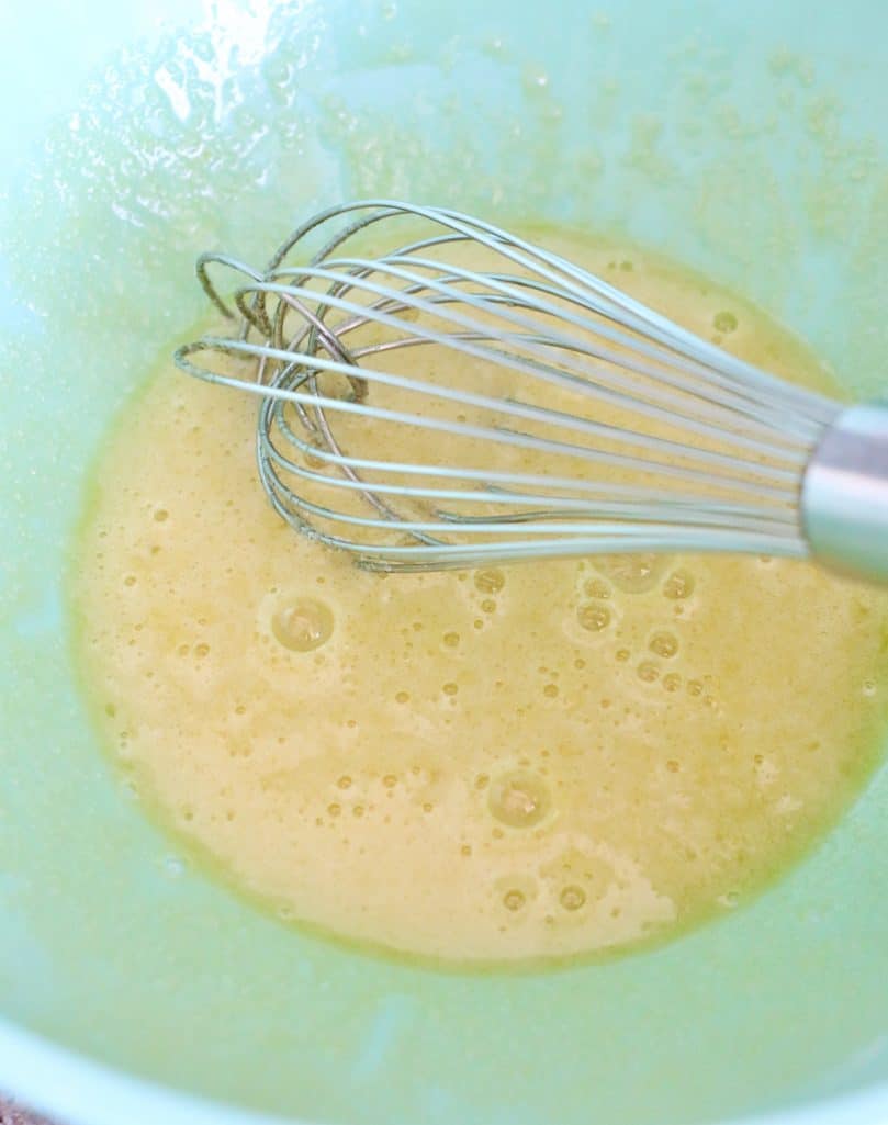 whisking an egg until frothy