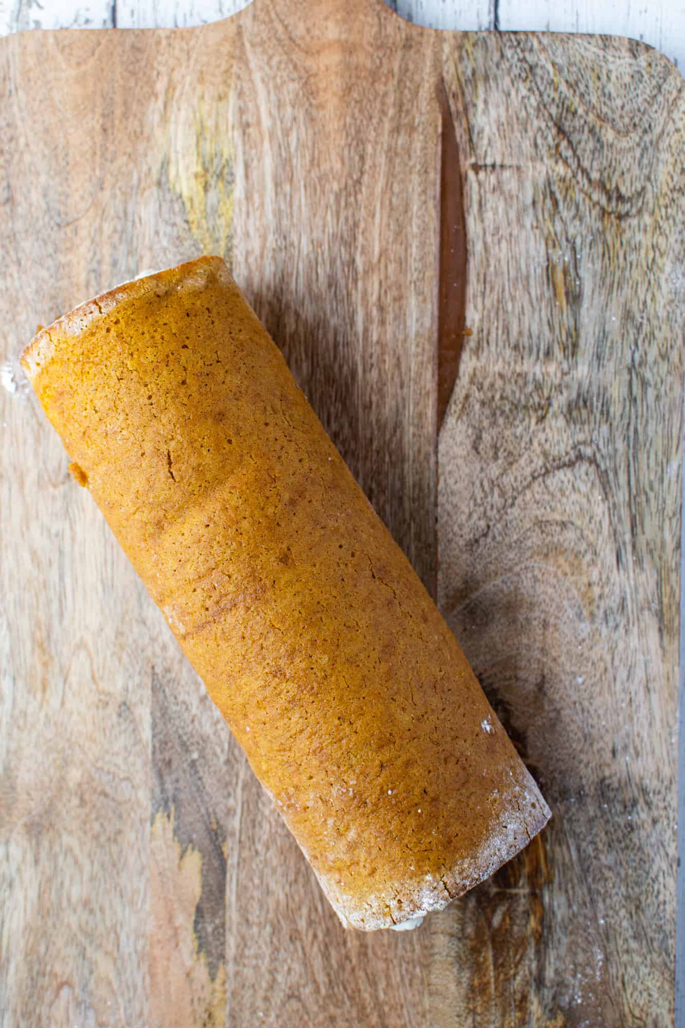 rolled up pumpkin cake with cream cheese filling.