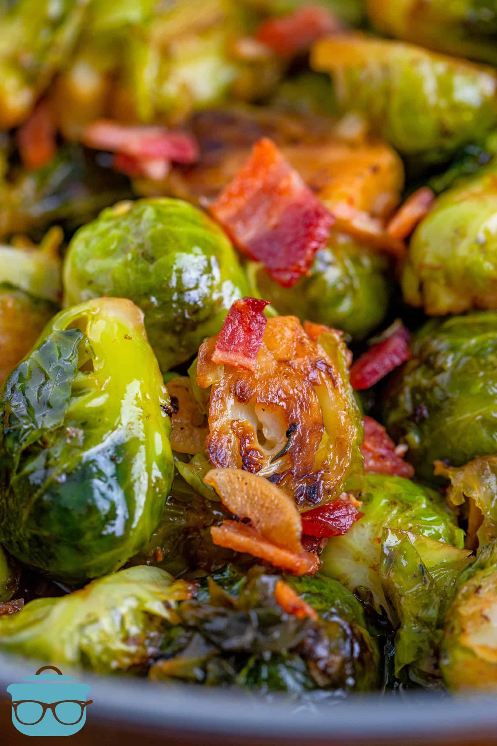 Stovetop Brussel Sprouts shown closeup, fully cooked and chopped bacon.