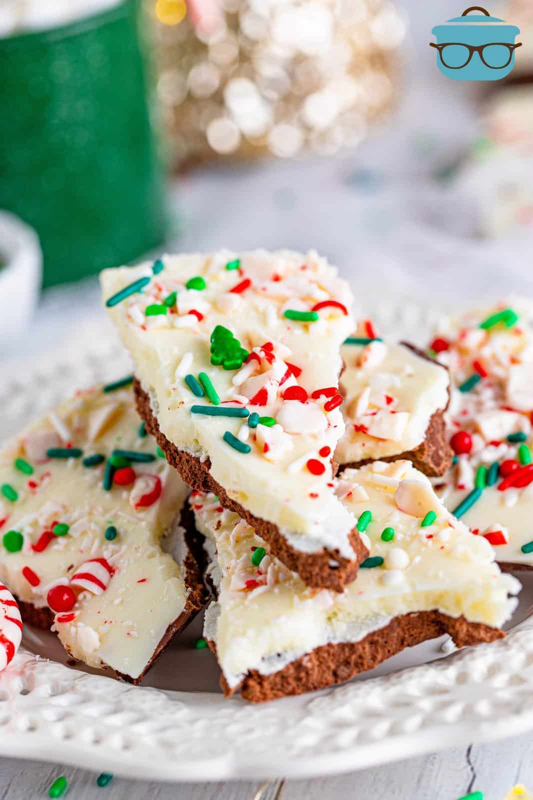 peppermint bark stacked on white plate.