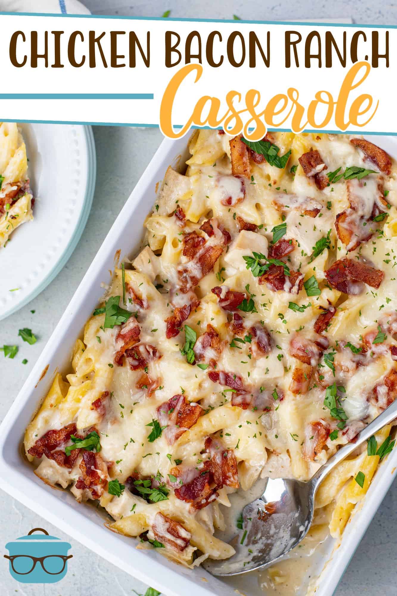 Chicken Bacon Ranch Casserole recipe from The Country Cook shown in a casserole dish and topped with chopped parsley.