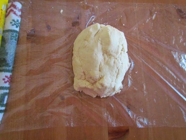 sugar cookie dough placed on plastic wrap