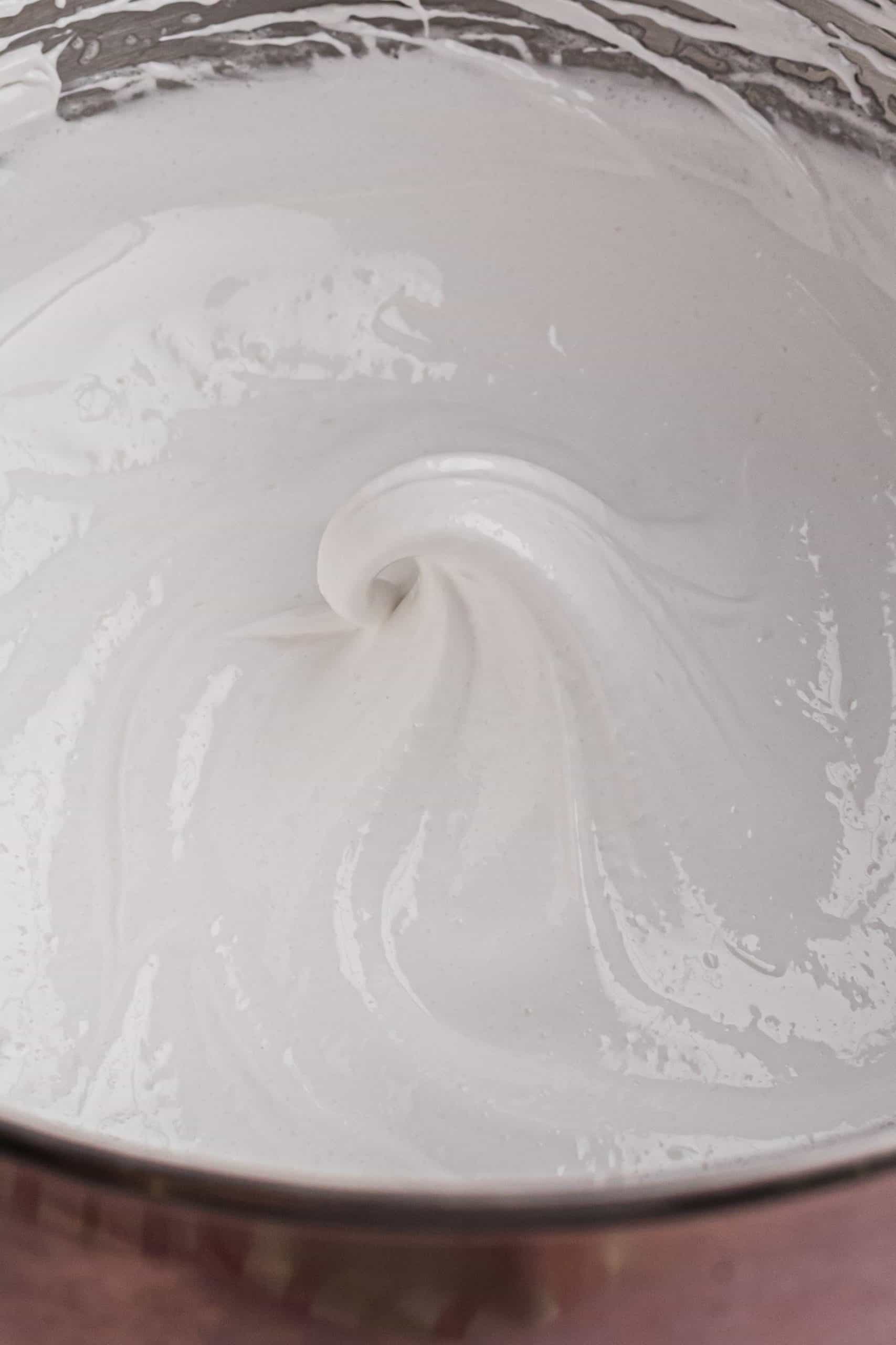 meringue shown inside a mixing bowl.