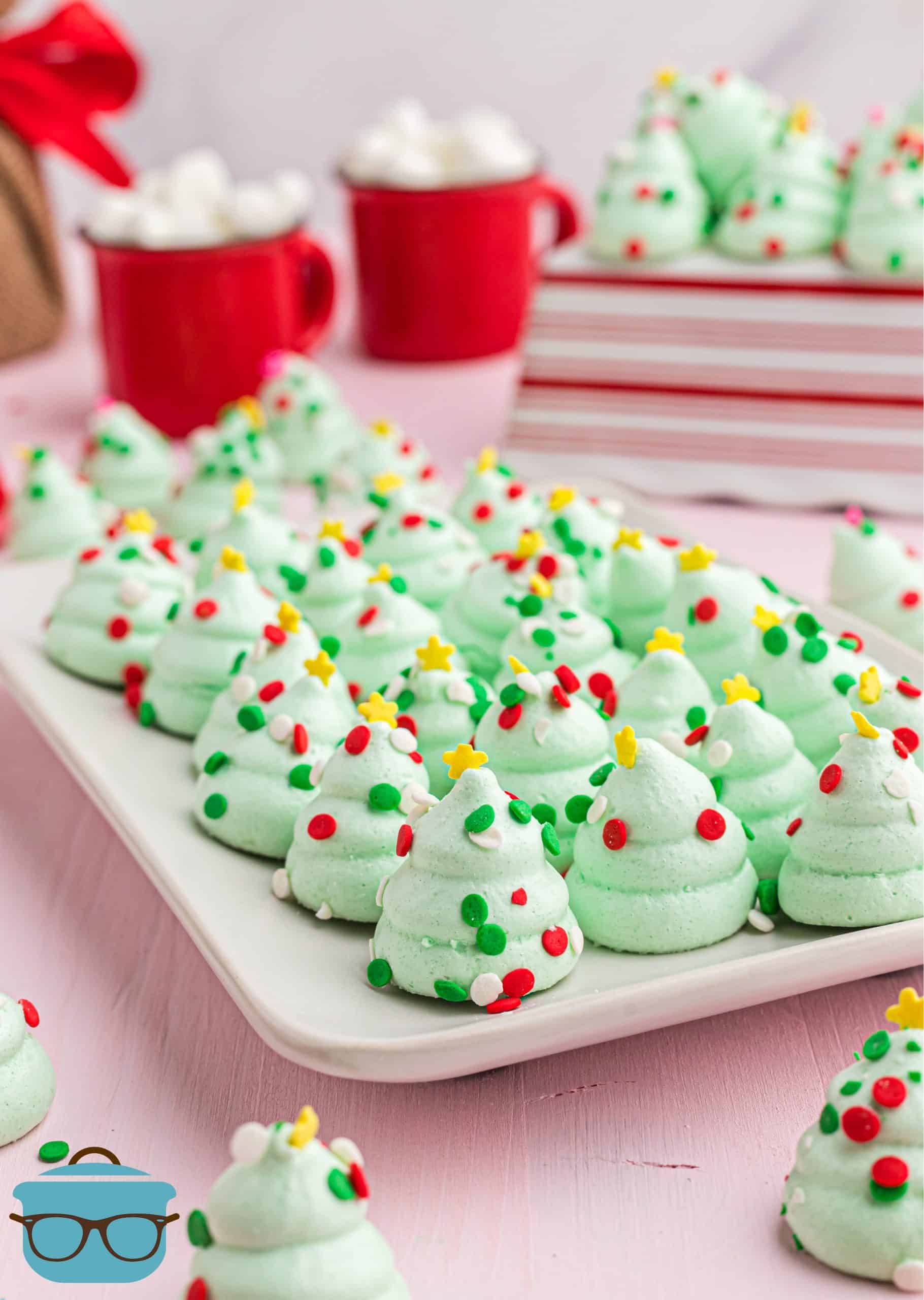 Meringue Christmas Trees in a single layer on a white platter.