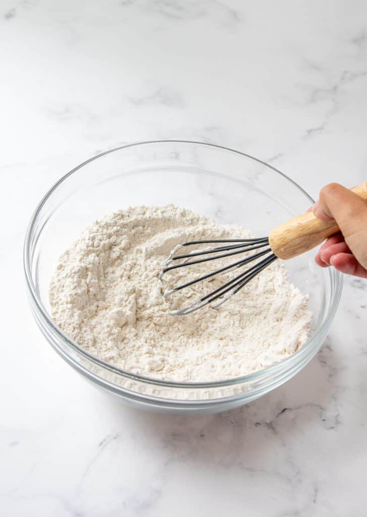 flour, baking soda and salt whisked together in a clear bowl.