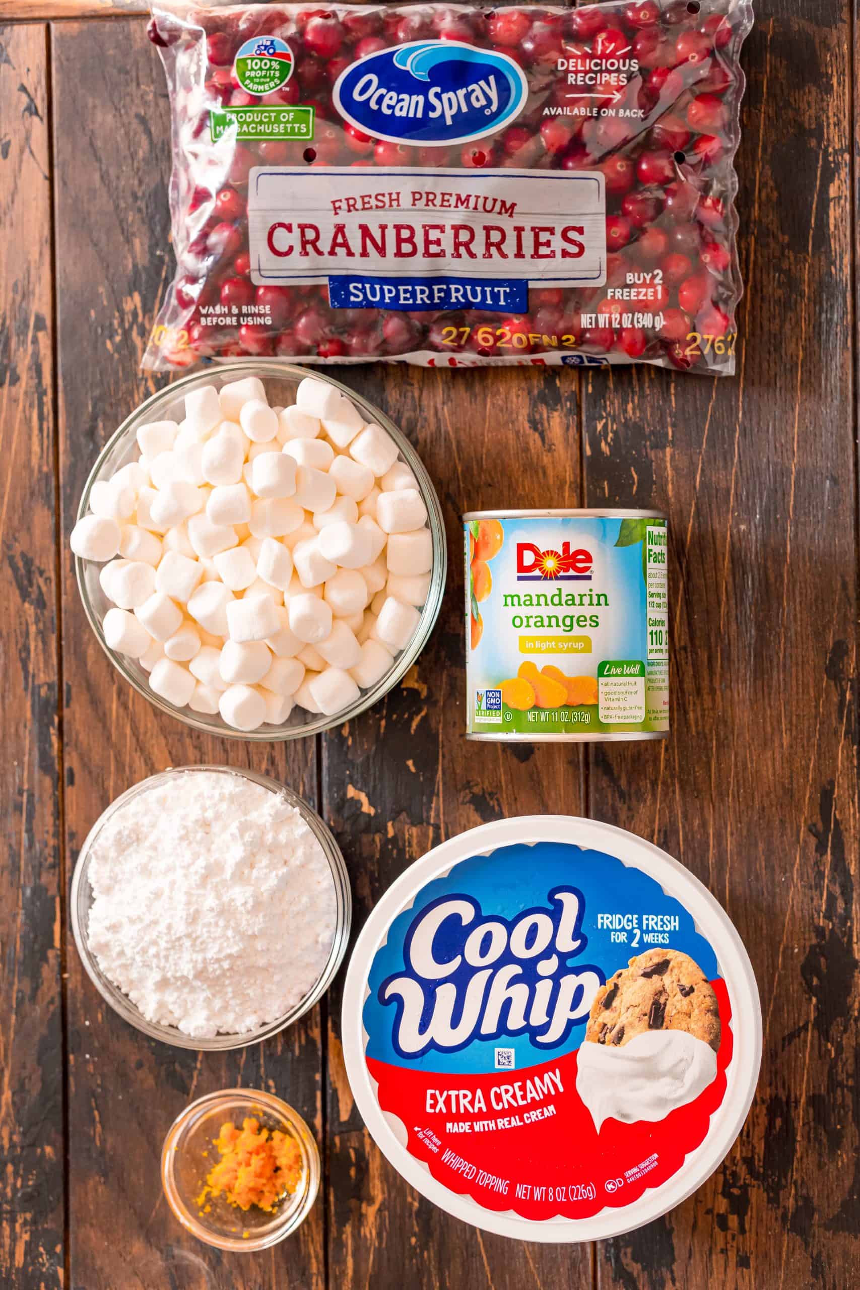whole cranberries, can of mandarin oranges in light syrup, powdered sugar, orange zest, a tub of Extra Creamy Cool Whip, mini marshmallows.