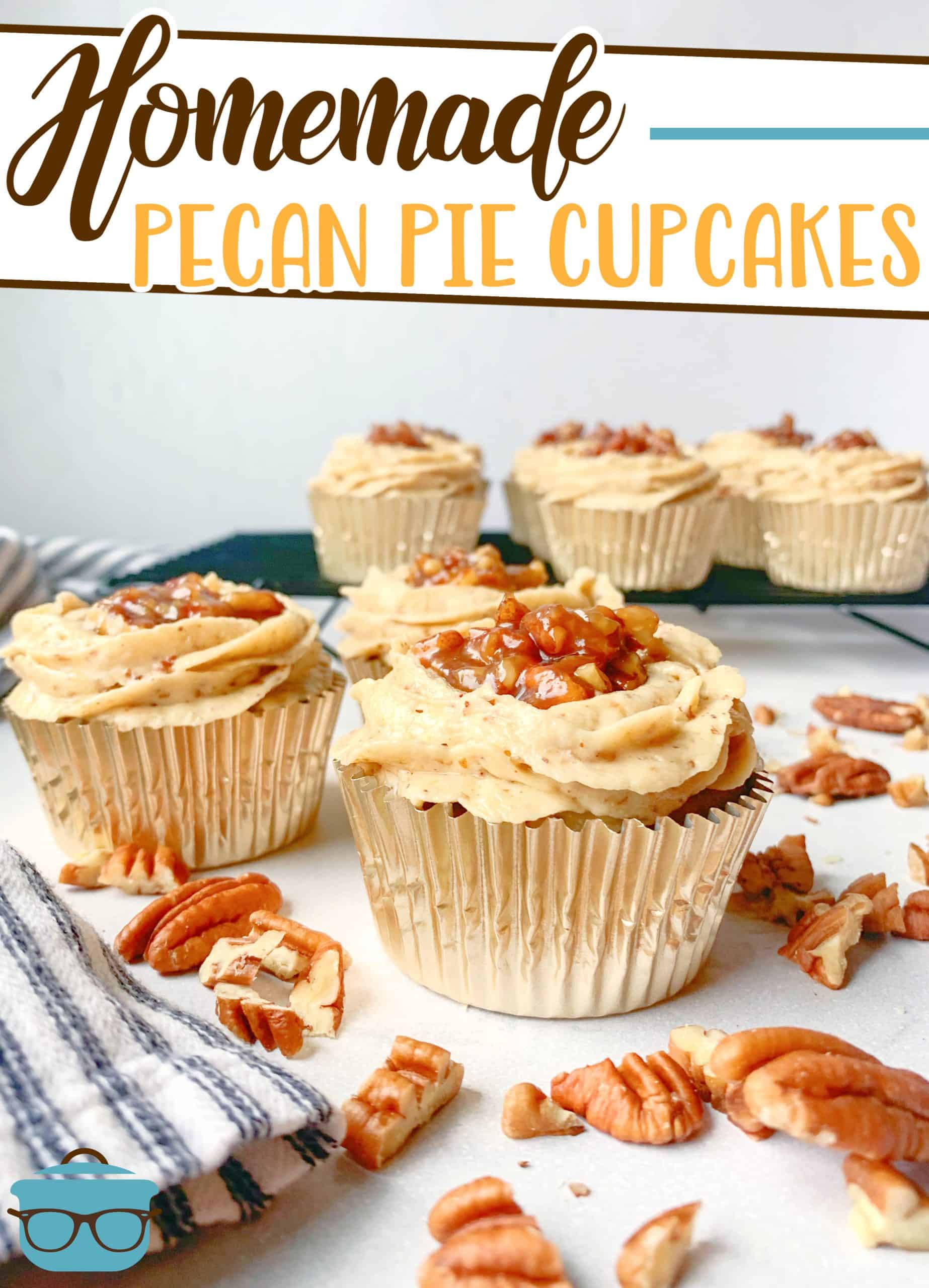 Homemade Pecan Pie Cupcakes, shown on a marble surface with pecans scattered around.