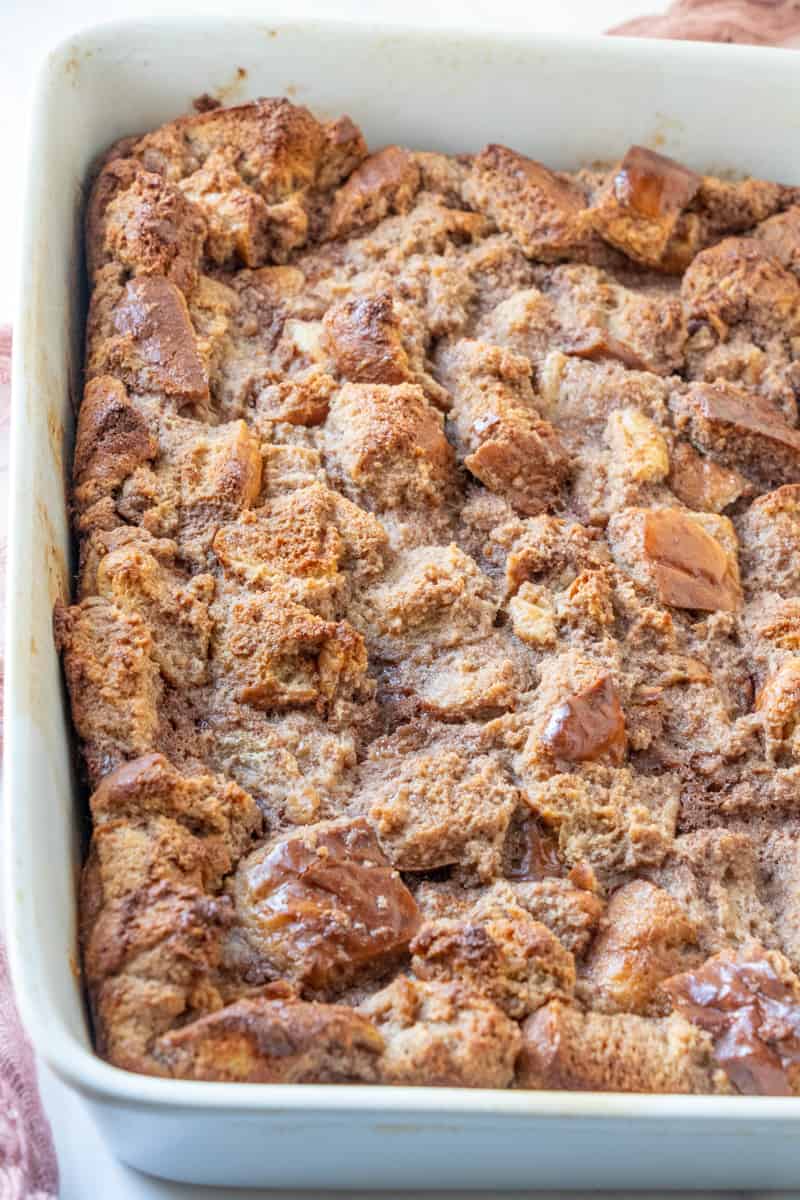 fully baked bread pudding in a white baking dish.