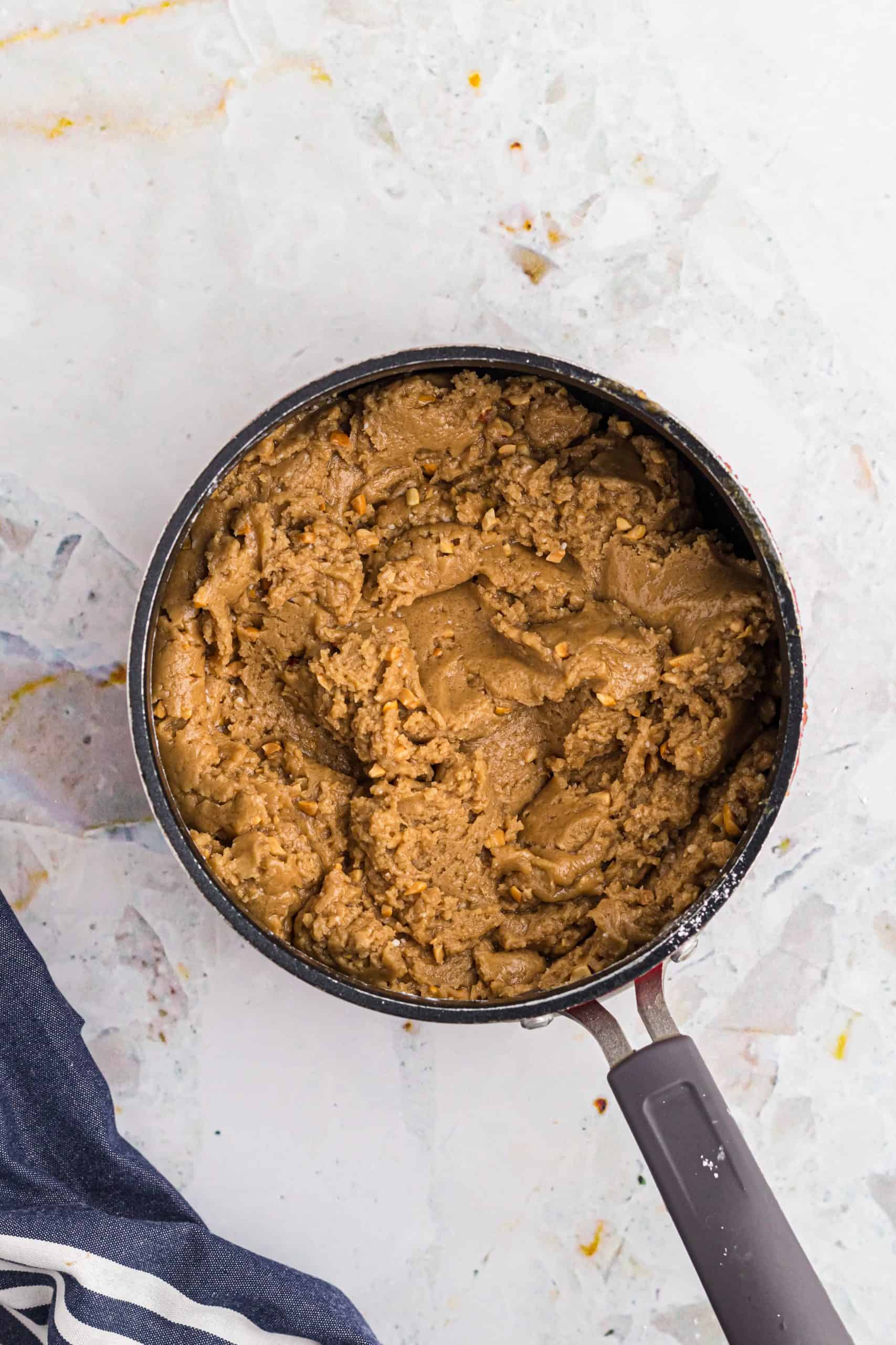 powdered sugar mixed into peanut butter mixture in a nonstick sauce pan.