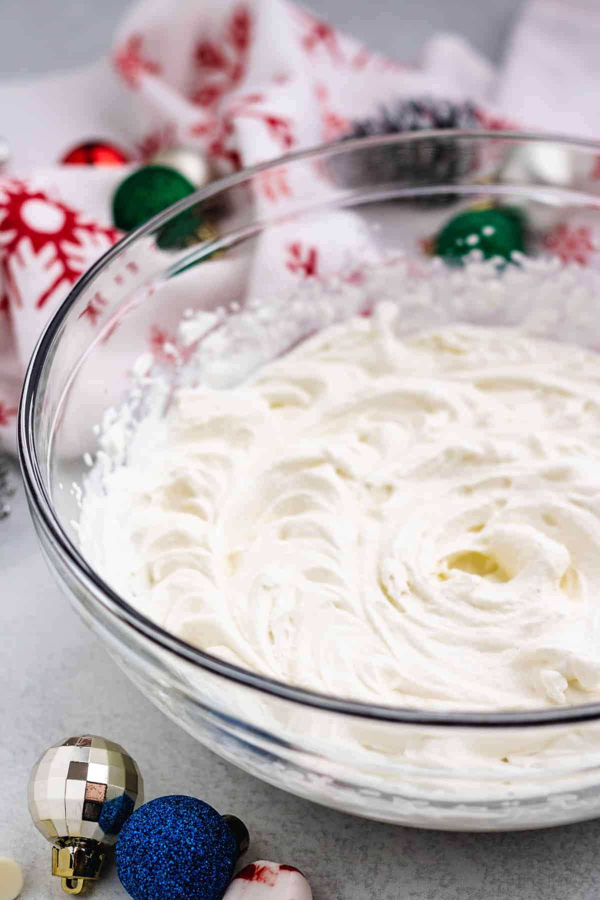 homemade whipped cream in a clear glass bowl.