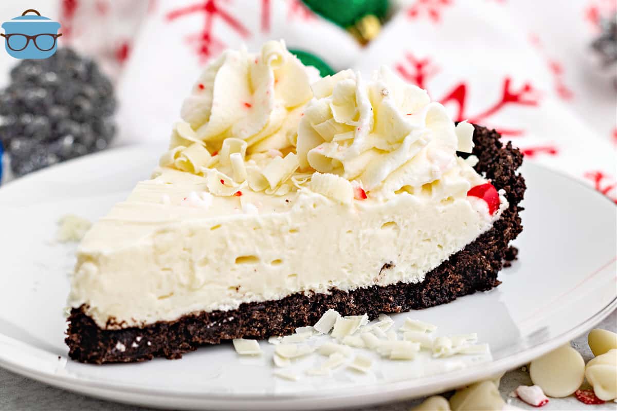 slice of white chocolate peppermint pie on a round white plate.