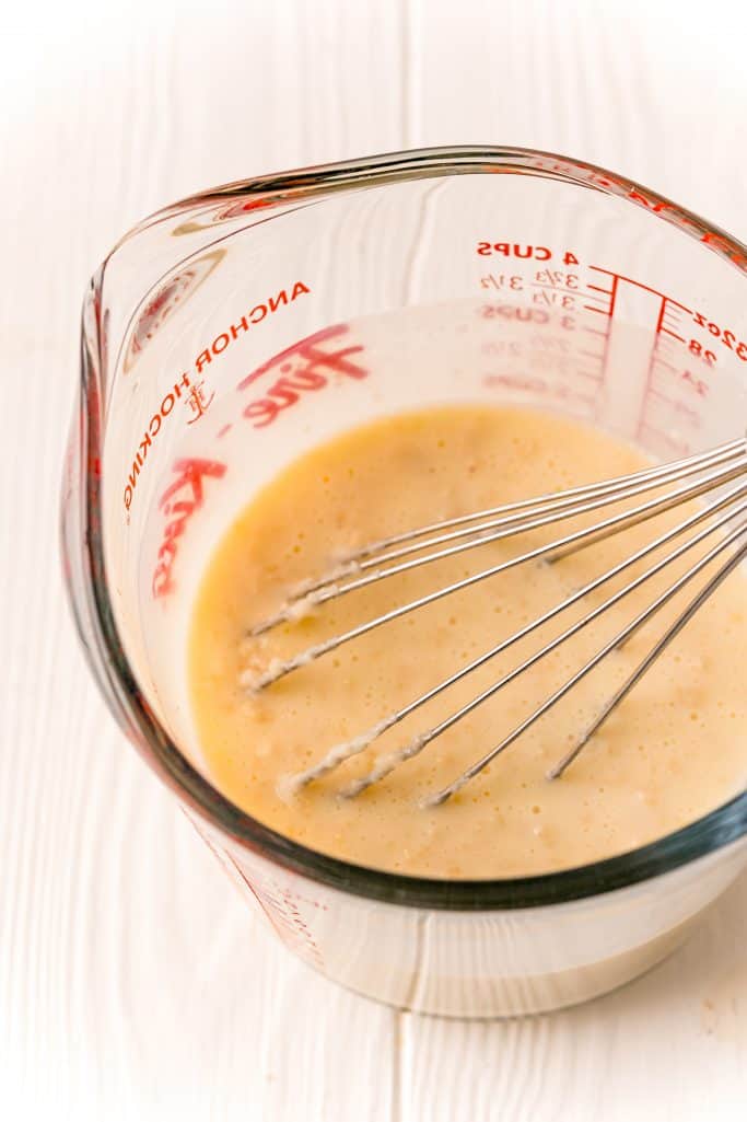 butter, bacon fat, buttermilk, egg and salt mixed together with a whisk in a large measuring cup