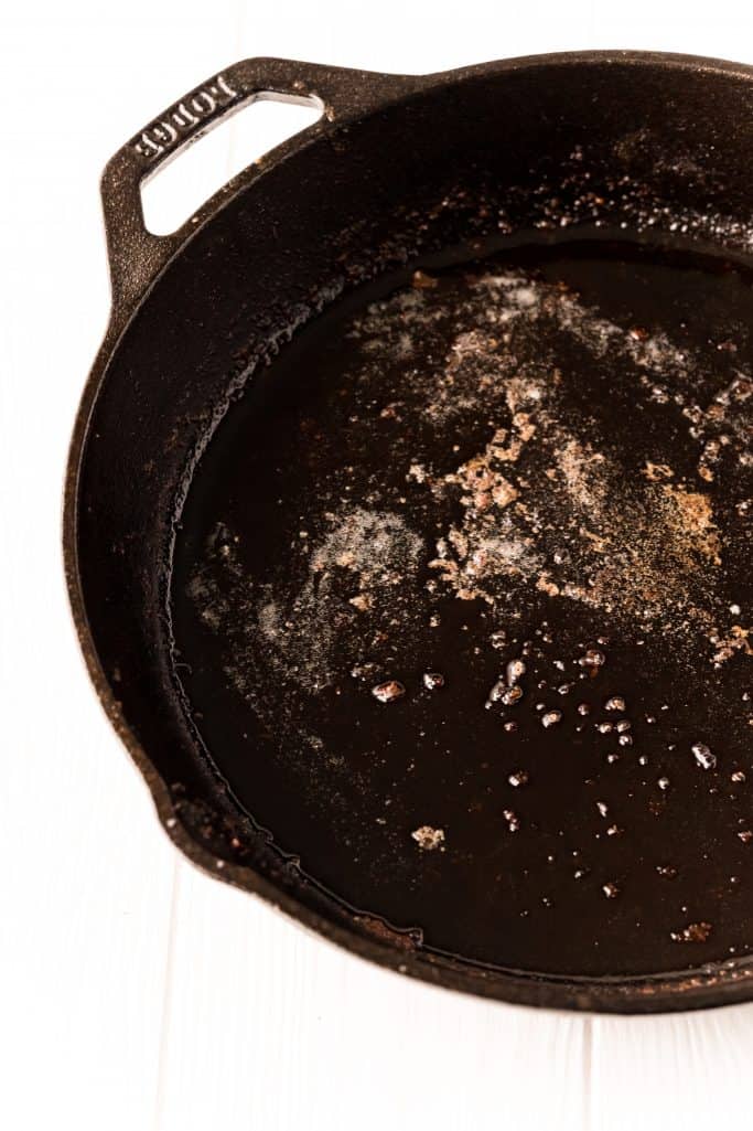 melted bacon fat and butter in a large black cast iron skillet