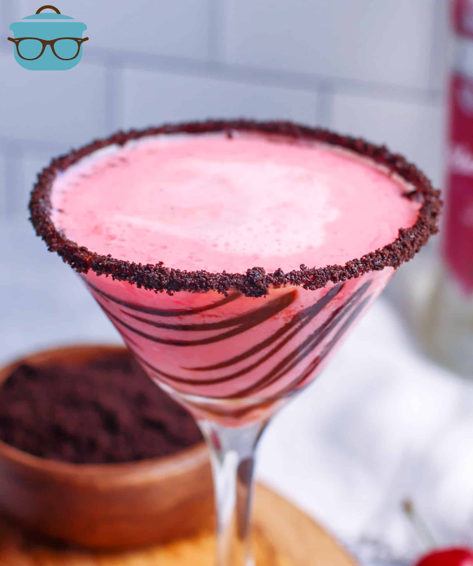 Cherry Garcia Martini in glass with rim topped with Oreos.