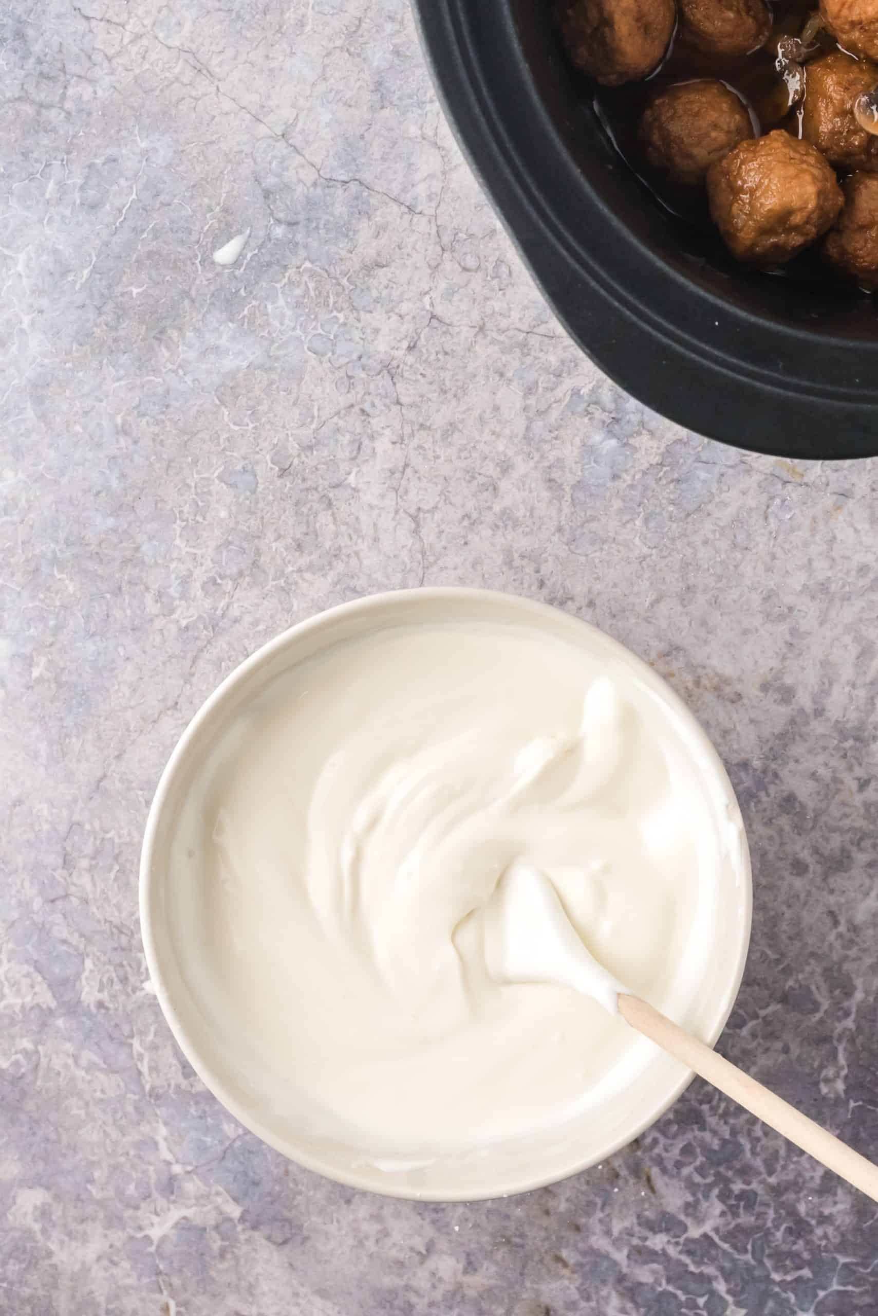 Cream mixture stirred up in bowl