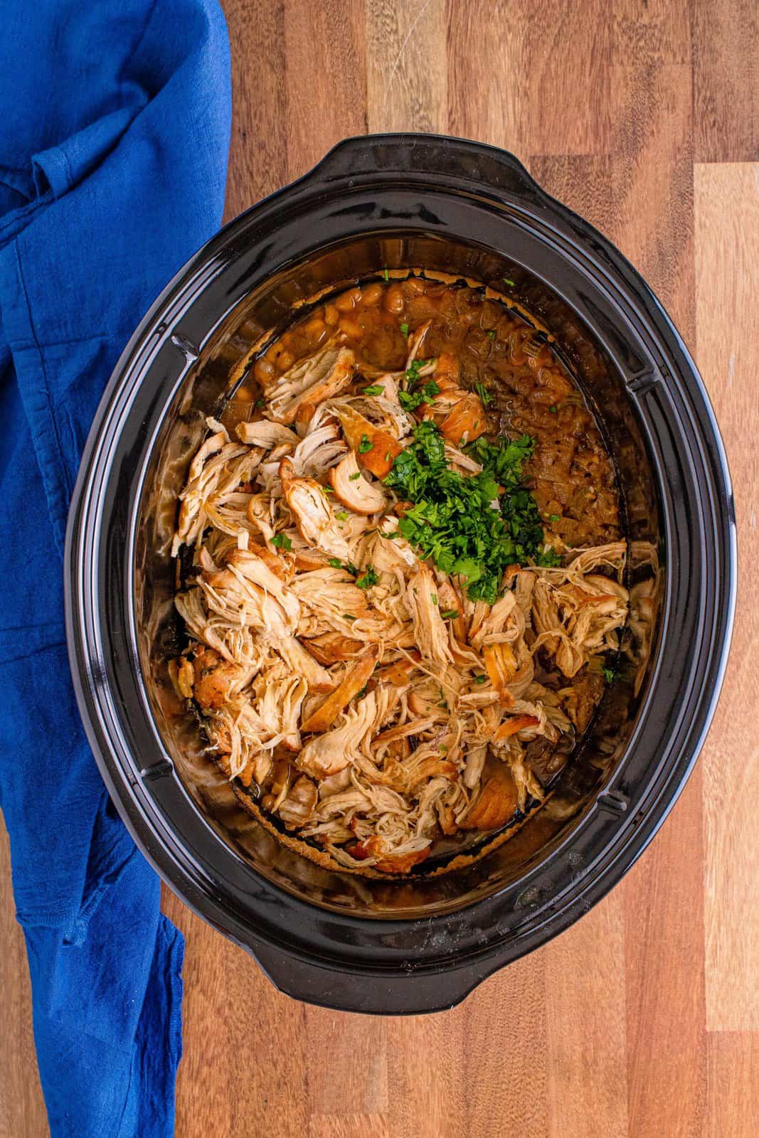 shredded chicken and cilantro put back into the slow cooker. 